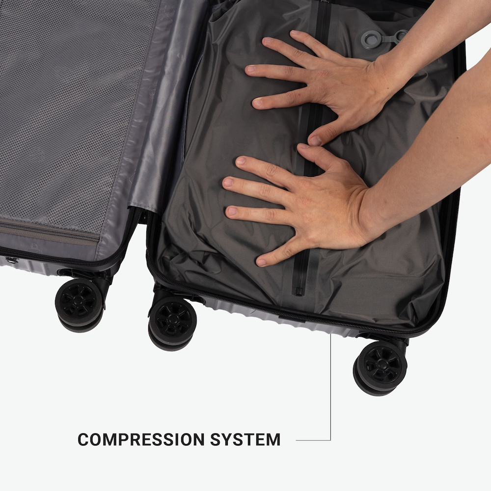 Hotel Collection Carry-On Luggage featuring a built-in compression system to maximize packing space and keep your items neatly organized during travel.