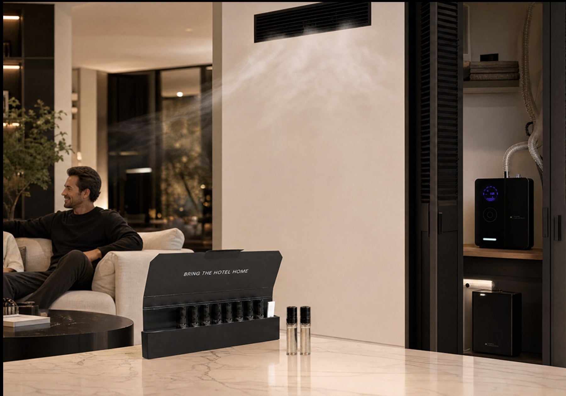 Living room scented by a Hotel Collection diffuser, with a sample kit on the counter